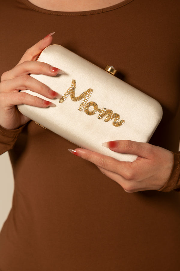 White Mom Clutch Bag for Mother's Day. Mom is written in 4-5 line gold beadwork.